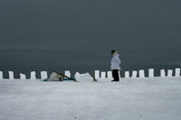 Simeon stands at the snow fence